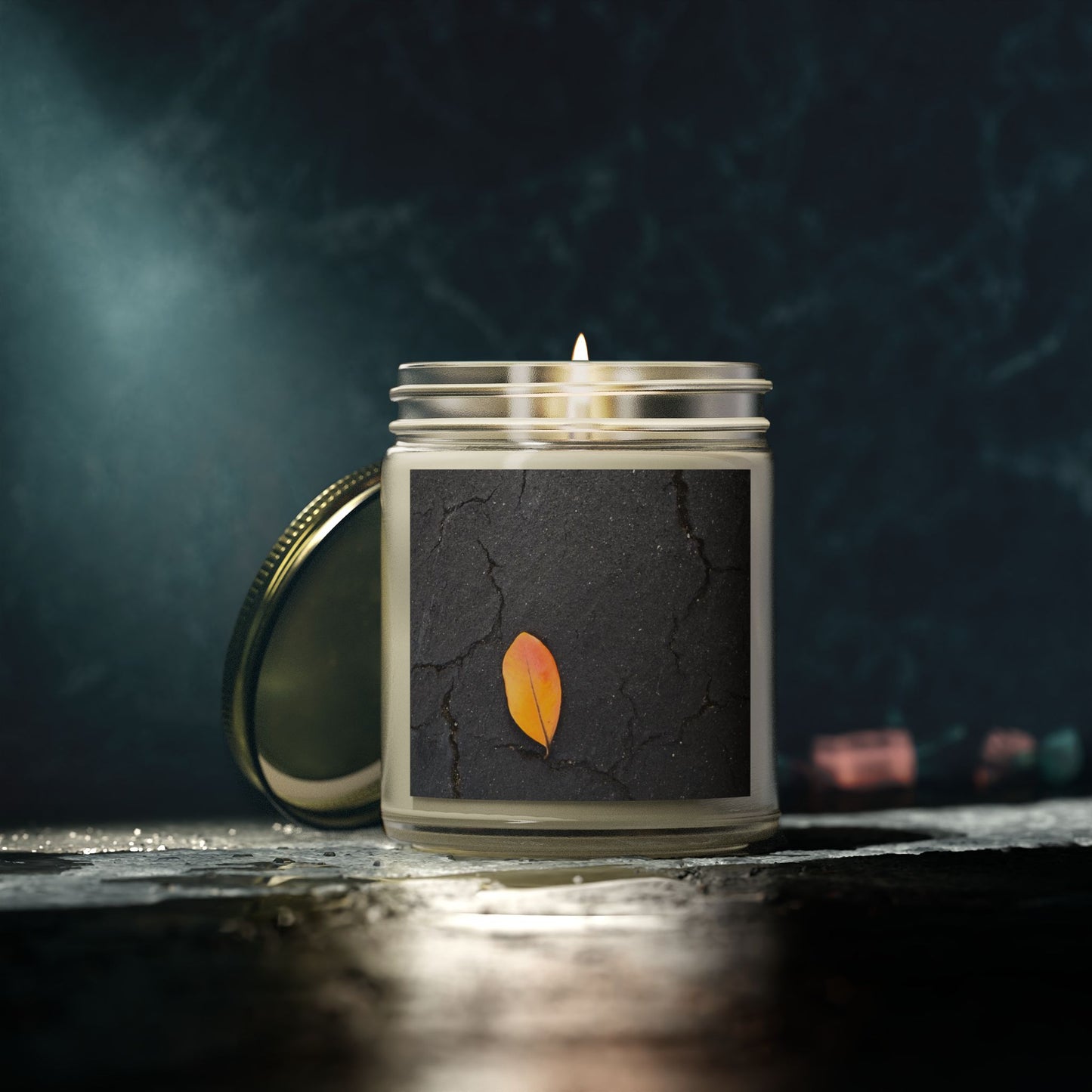 Orange Leaf on Black Concrete Jar Candle – Minimalist Autumn Decor with Urban Nature-Inspired Photography and Moody Fall Aesthetic