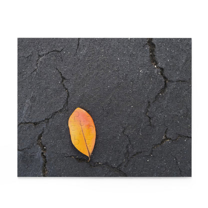 Orange Leaf on Black Concrete Puzzle – Moody Autumn Jigsaw for Minimalist Fall Decor and Nature Lovers