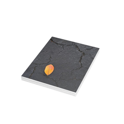 Orange Leaf on Black Concrete Inspirational Postcard – Minimalist Autumn Decor for Modern Homes
