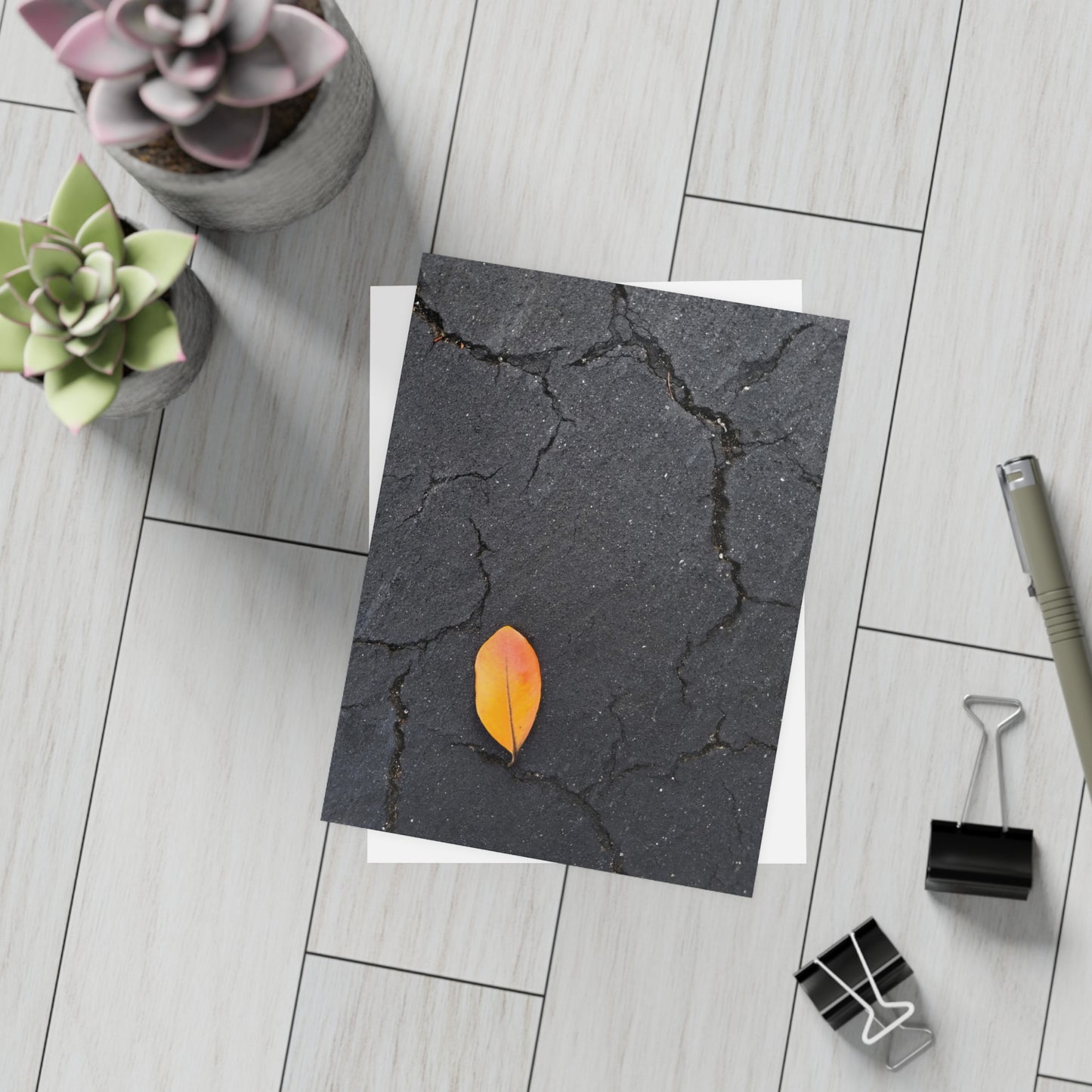 Orange Leaf on Black Concrete Inspirational Postcard – Minimalist Autumn Decor for Modern Homes