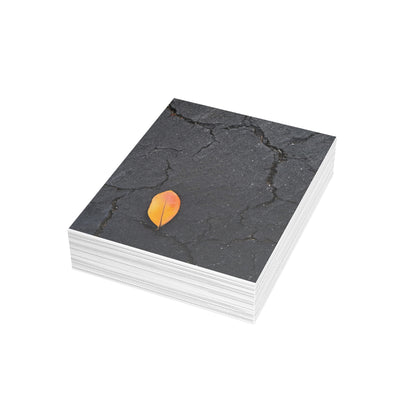 Orange Leaf on Black Concrete Inspirational Postcard – Minimalist Autumn Decor for Modern Homes