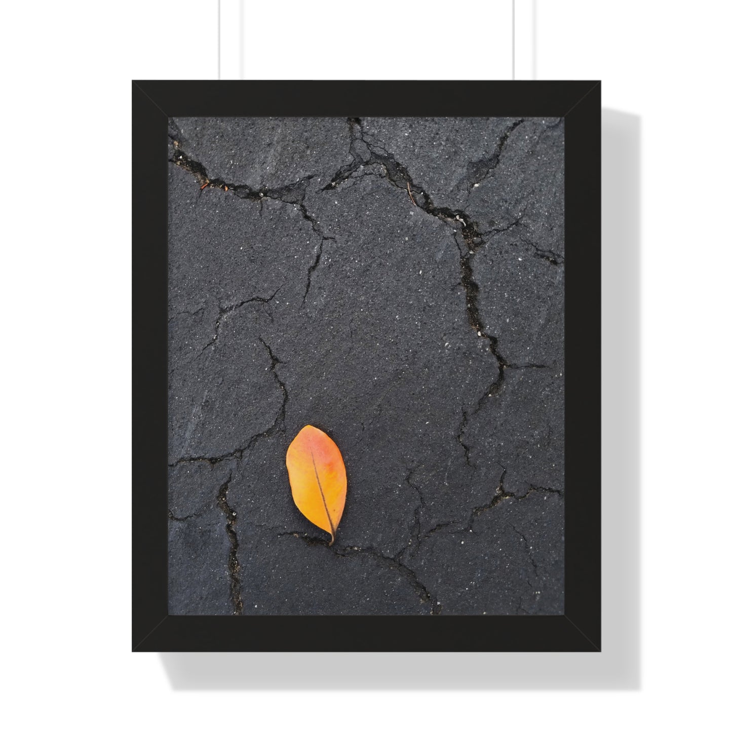 Orange Leaf on Black Concrete Framed Print – Minimalist Autumn Wall Art for Urban and Modern Rustic Decor
