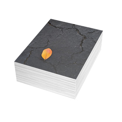 Orange Leaf on Black Concrete Inspirational Postcard – Minimalist Autumn Decor for Modern Homes