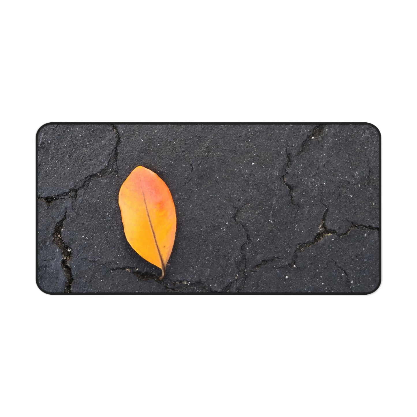 Orange Leaf Against Black Concrete Desk Mat – Minimalist Modern Nature-Inspired Tabletop Decor