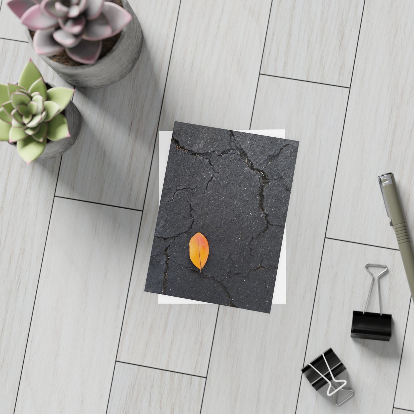 Orange Leaf on Black Concrete Inspirational Postcard – Minimalist Autumn Decor for Modern Homes