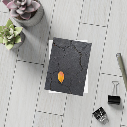 Orange Leaf on Black Concrete Inspirational Postcard – Minimalist Autumn Decor for Modern Homes