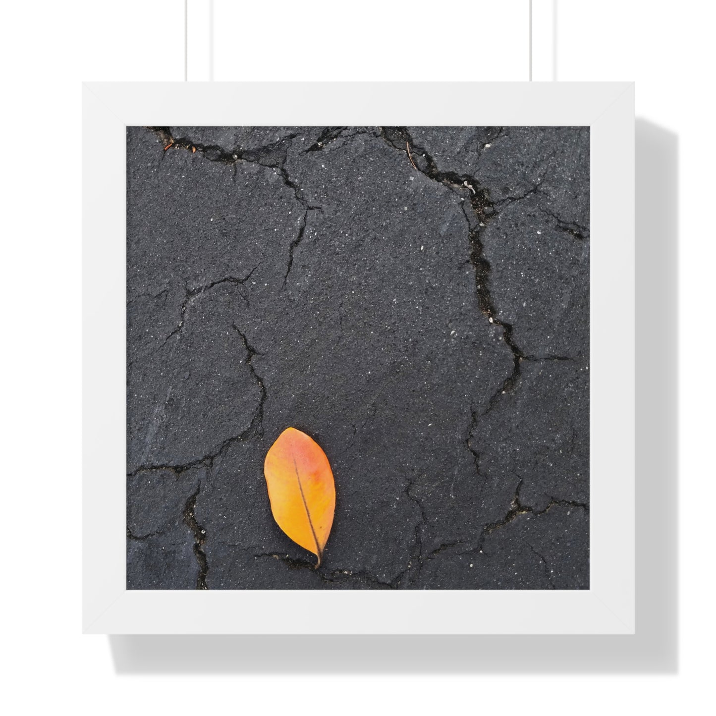 Orange Leaf on Black Concrete Framed Print – Minimalist Autumn Wall Art for Urban and Modern Rustic Decor