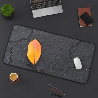 Orange Leaf Against Black Concrete Desk Mat – Minimalist Modern Nature-Inspired Tabletop Decor