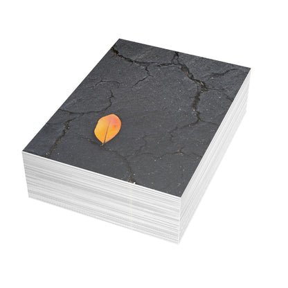 Orange Leaf on Black Concrete Inspirational Postcard – Minimalist Autumn Decor for Modern Homes