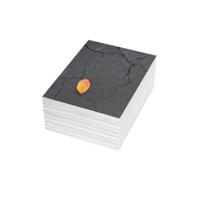 Orange Leaf on Black Concrete Inspirational Postcard – Minimalist Autumn Decor for Modern Homes