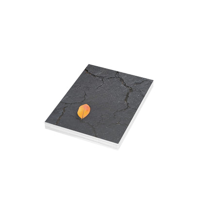Orange Leaf on Black Concrete Inspirational Postcard – Minimalist Autumn Decor for Modern Homes