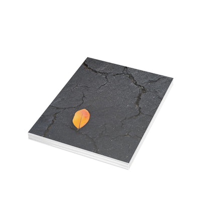 Orange Leaf on Black Concrete Inspirational Postcard – Minimalist Autumn Decor for Modern Homes