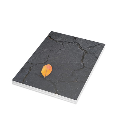Orange Leaf on Black Concrete Inspirational Postcard – Minimalist Autumn Decor for Modern Homes