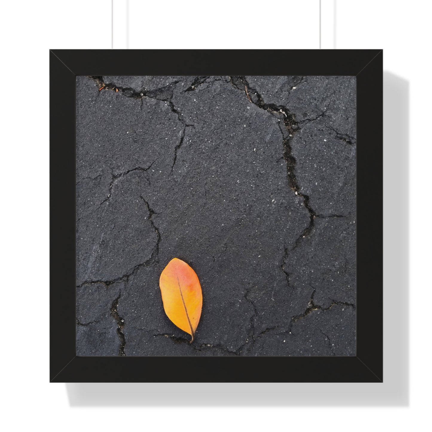Orange Leaf on Black Concrete Framed Print – Minimalist Autumn Wall Art for Urban and Modern Rustic Decor