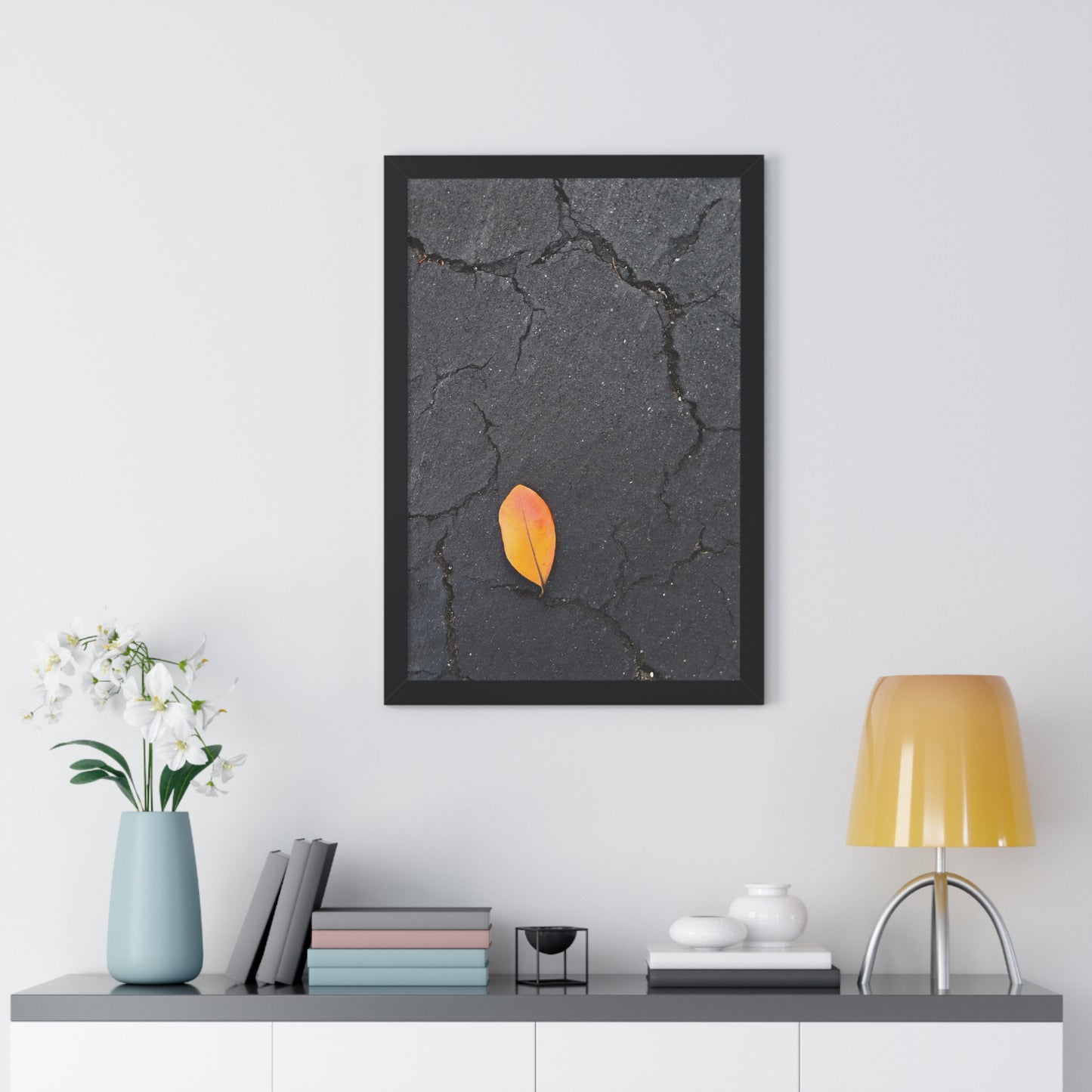 Orange Leaf on Black Concrete Framed Print – Minimalist Autumn Wall Art for Urban and Modern Rustic Decor