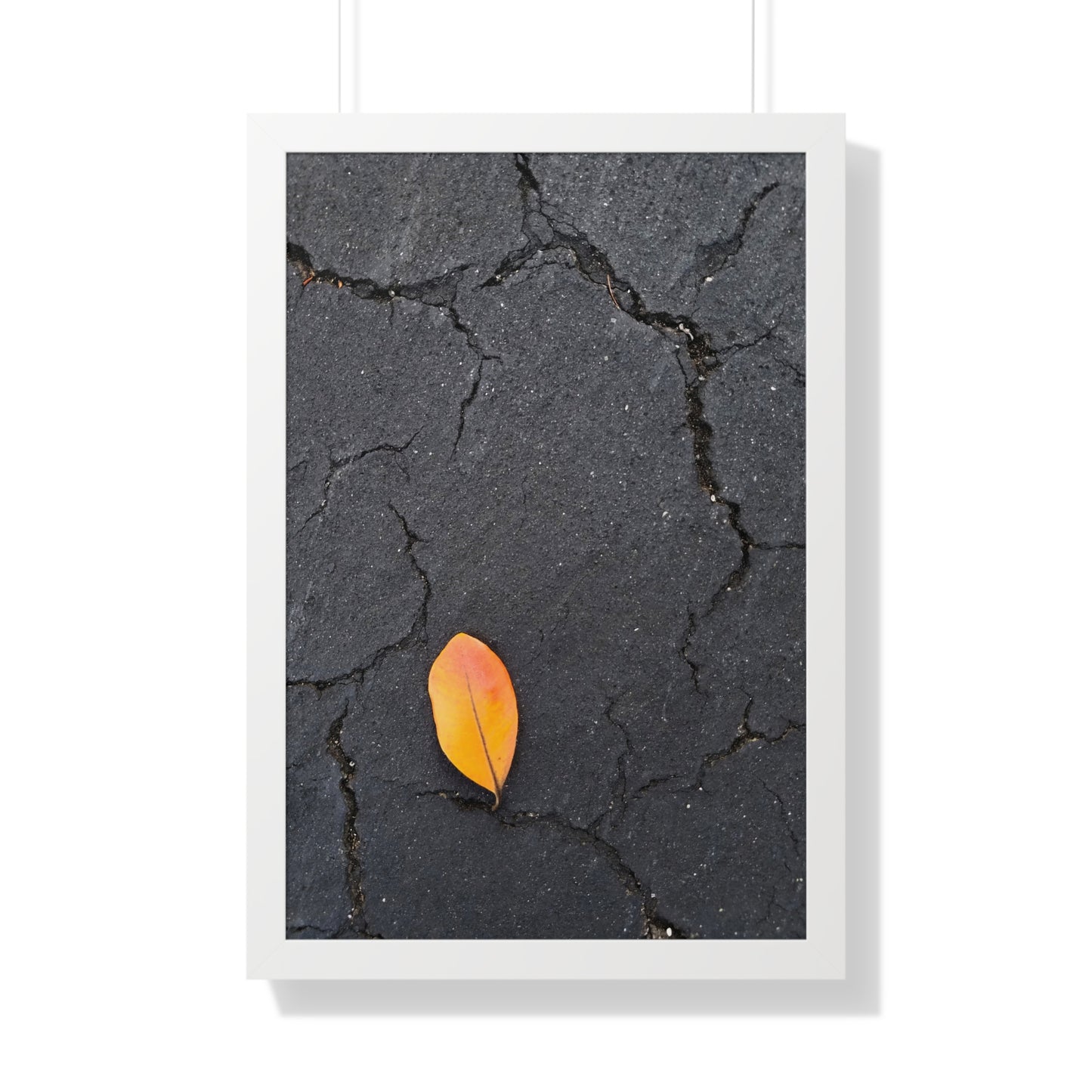 Orange Leaf on Black Concrete Framed Print – Minimalist Autumn Wall Art for Urban and Modern Rustic Decor