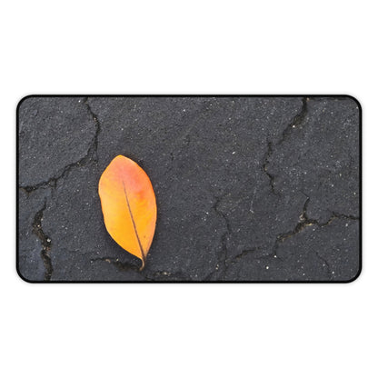 Orange Leaf Against Black Concrete Desk Mat – Minimalist Modern Nature-Inspired Tabletop Decor