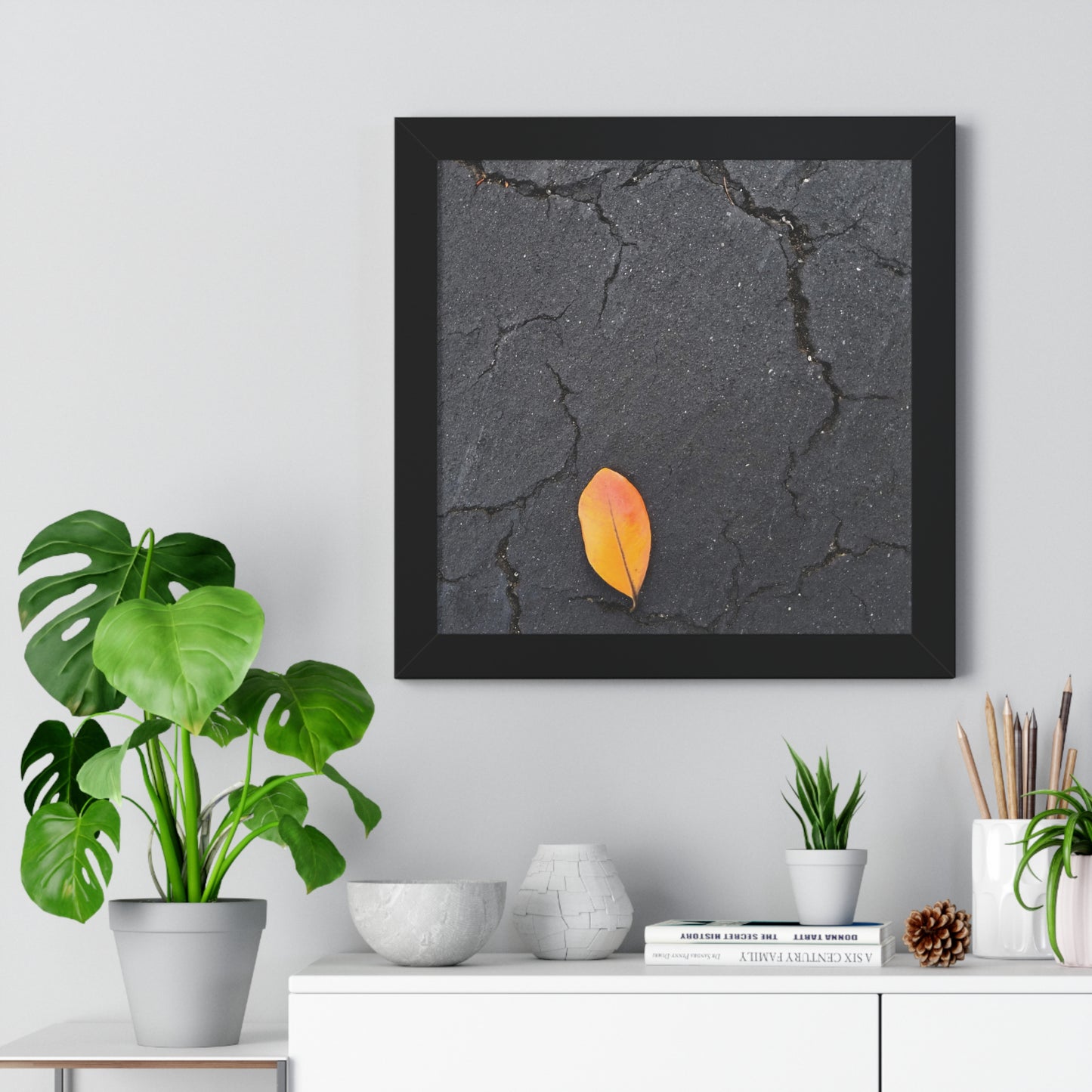 Orange Leaf on Black Concrete Framed Print – Minimalist Autumn Wall Art for Urban and Modern Rustic Decor