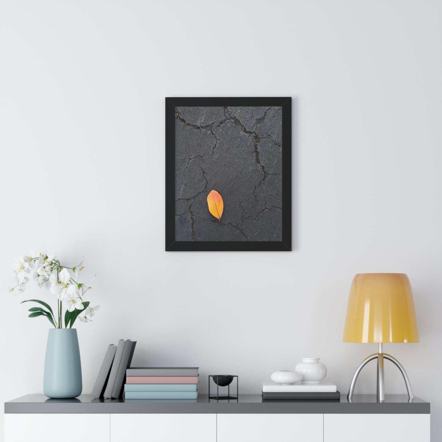 Orange Leaf on Black Concrete Framed Print – Minimalist Autumn Wall Art for Urban and Modern Rustic Decor