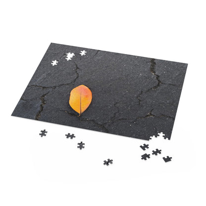 Orange Leaf on Black Concrete Puzzle – Moody Autumn Jigsaw for Minimalist Fall Decor and Nature Lovers