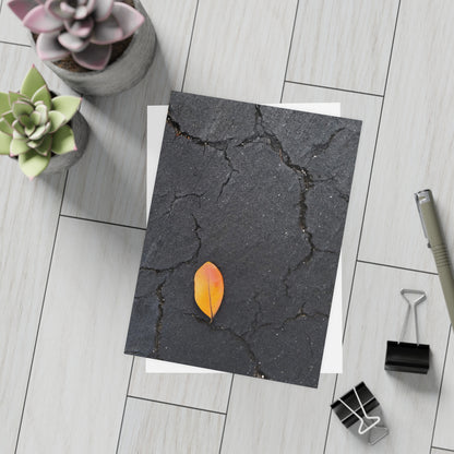 Orange Leaf on Black Concrete Inspirational Postcard – Minimalist Autumn Decor for Modern Homes