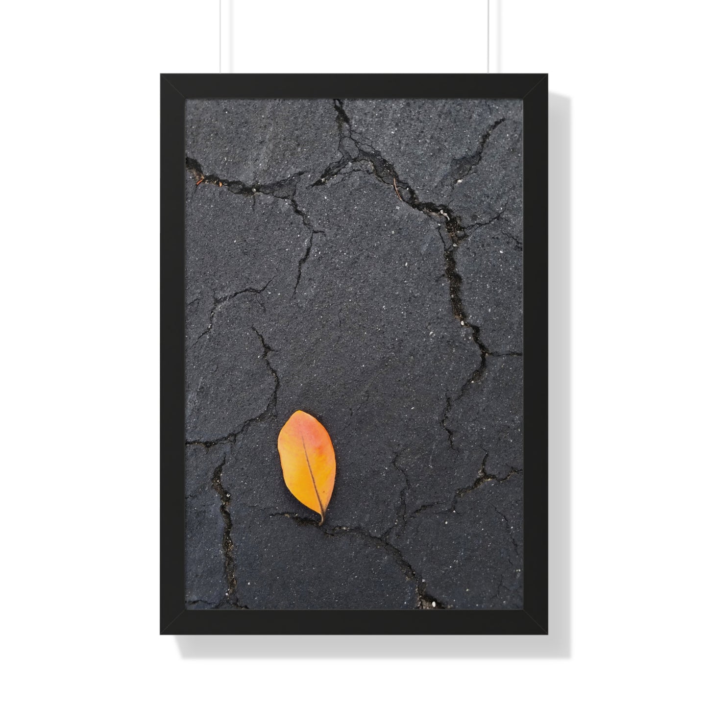 Orange Leaf on Black Concrete Framed Print – Minimalist Autumn Wall Art for Urban and Modern Rustic Decor
