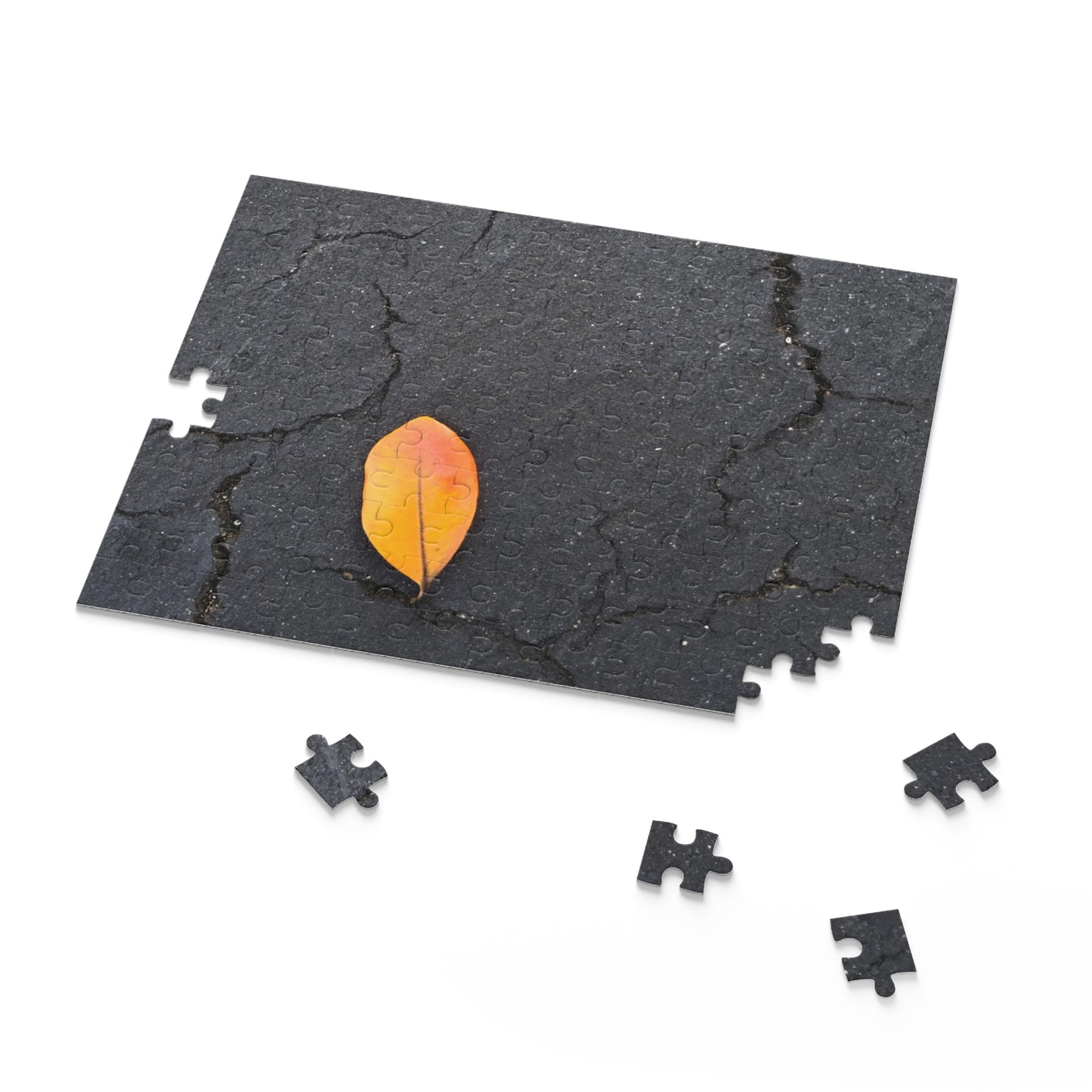 Orange Leaf on Black Concrete Puzzle – Moody Autumn Jigsaw for Minimalist Fall Decor and Nature Lovers